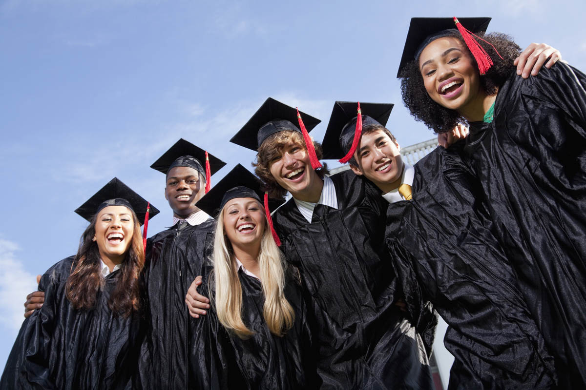 High school students in graduation regalia