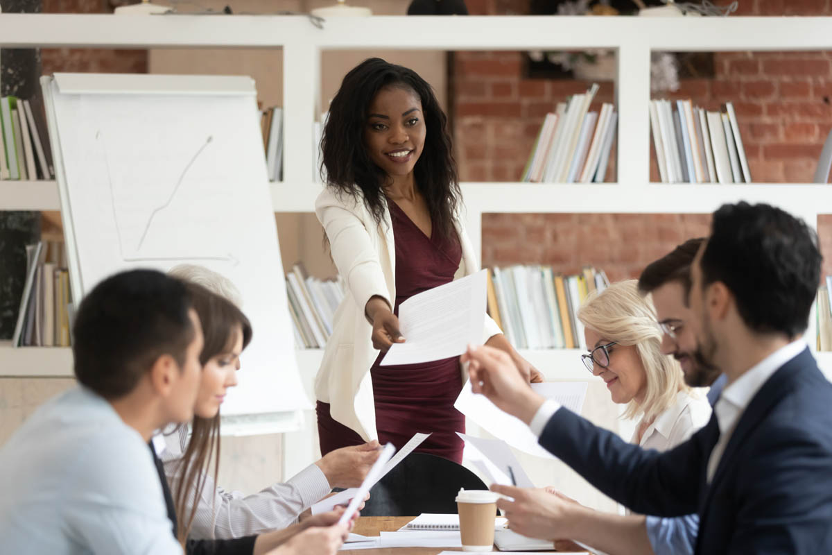 Photo of woman holding meeting